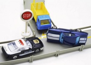 Toy cars at a stop sign