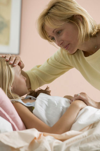Mom taking care of sick daughter