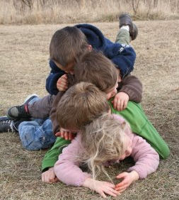 KidsPiledUp kids pig-piled on top of each other