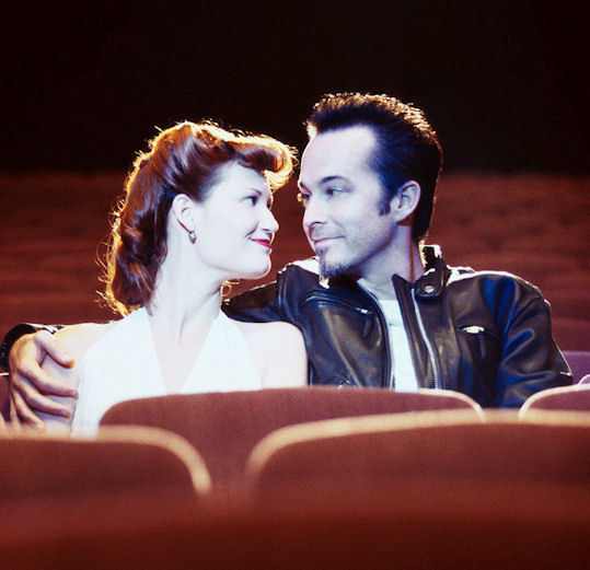 Couple Kissing During Movie couple in movie theater