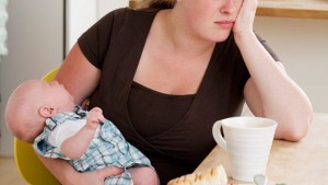 Tired mom and new baby