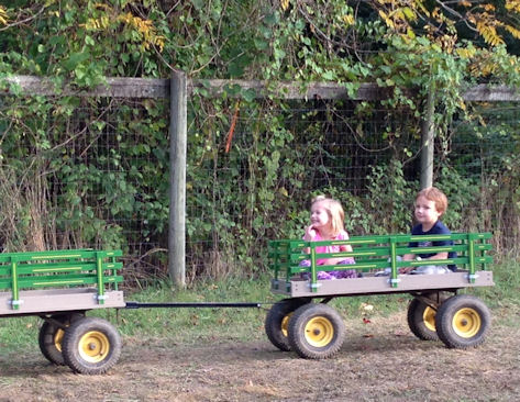 2 kids on a tractor ride