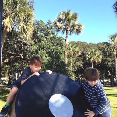 Boys climbing on a cannon at the Battery in Charleston