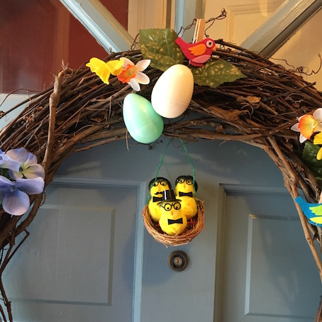 Spring wreath featuring plastic eggs and yellow chicks